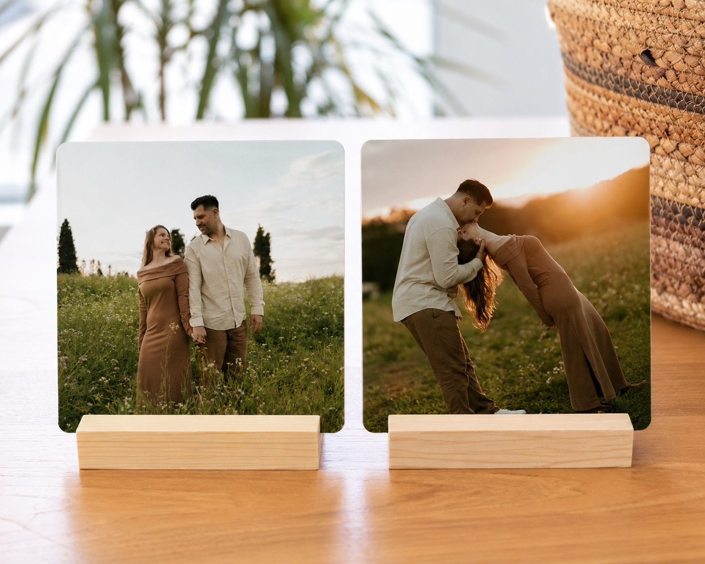 An anniversary desk print on a wooden stand beside a plant on a desk
