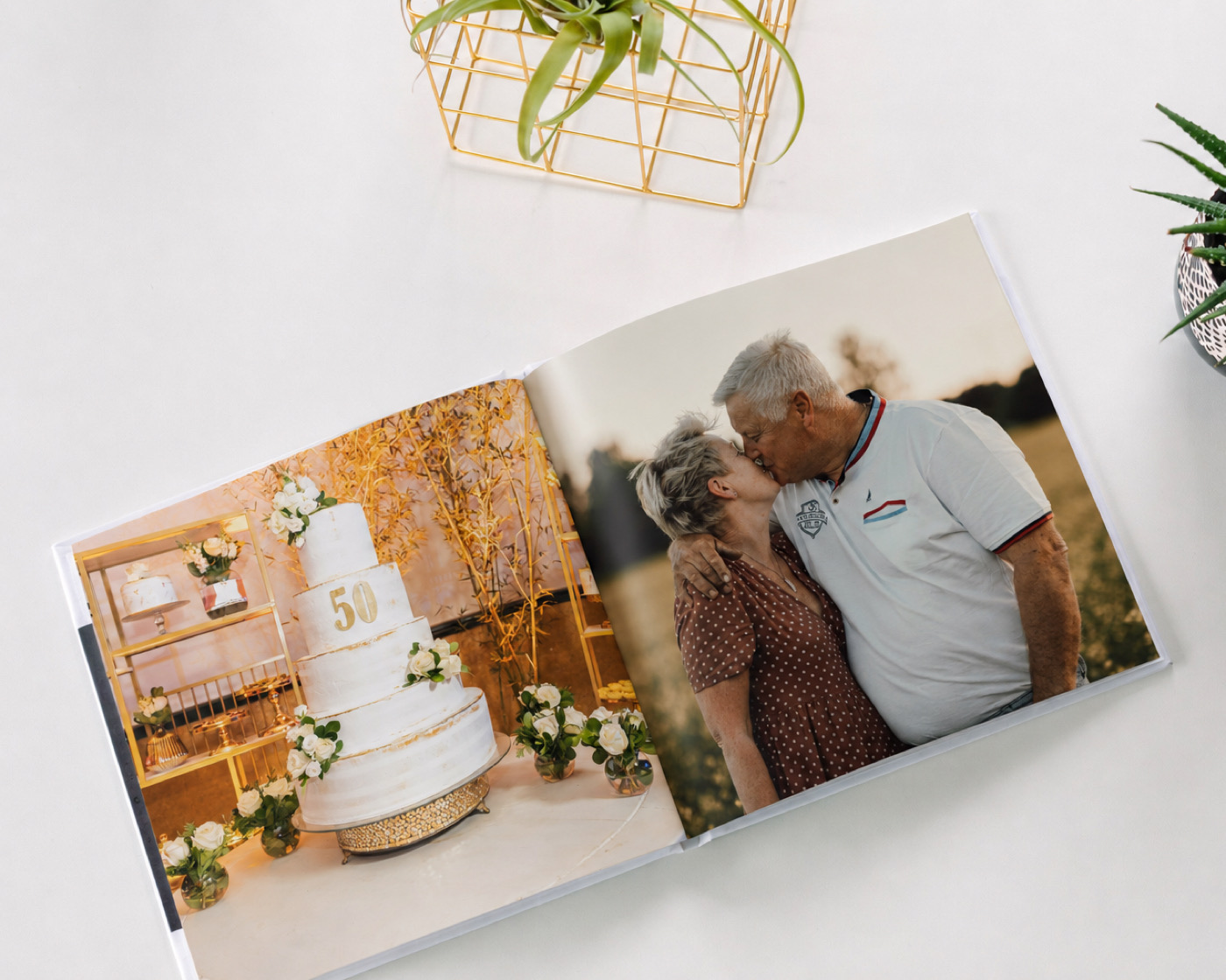An open SimplePrints anniversary photo book showing a spread of a couple through the years
