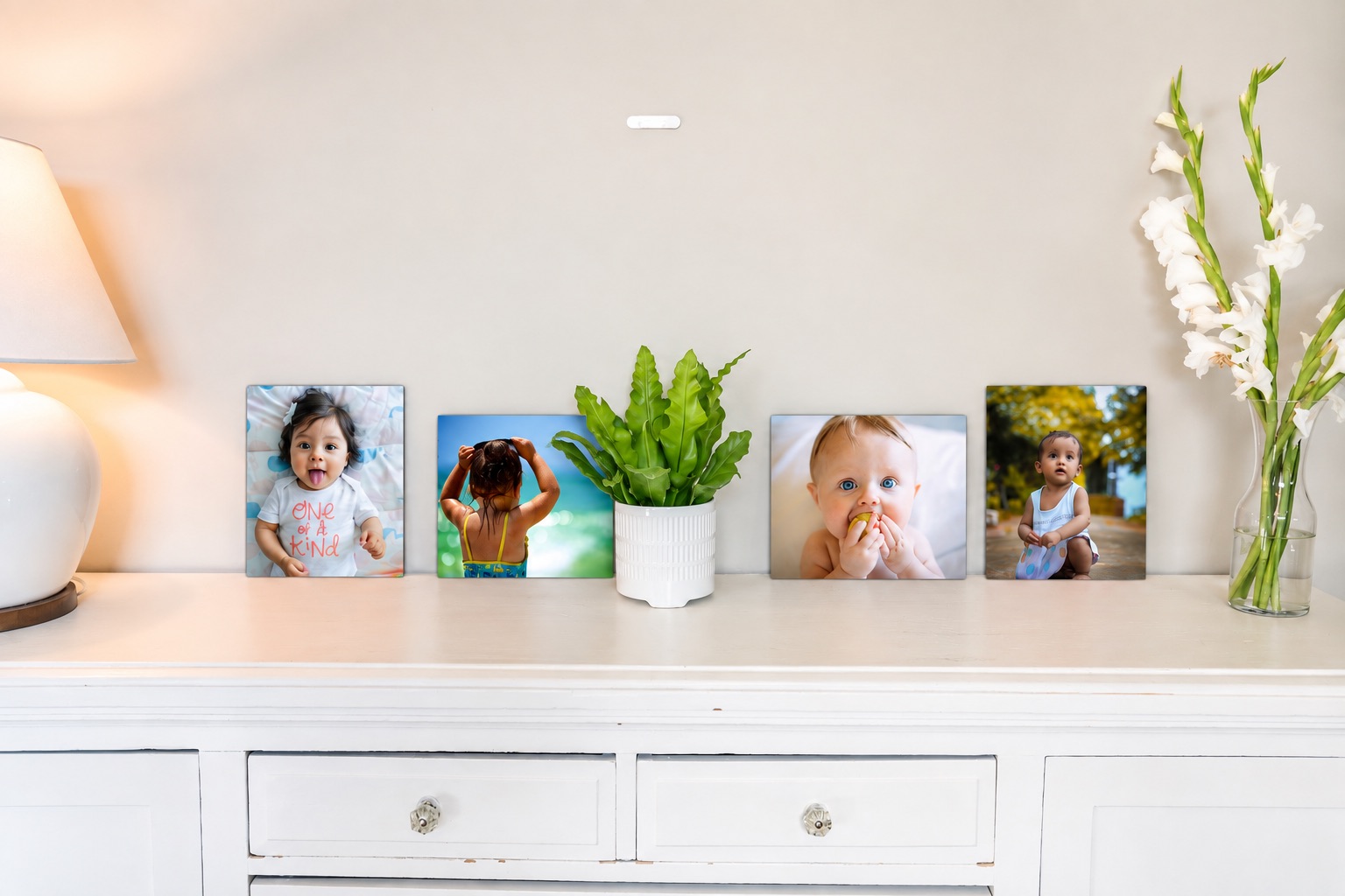 SimplePrints baby metal prints displayed at different sizes on a shelf