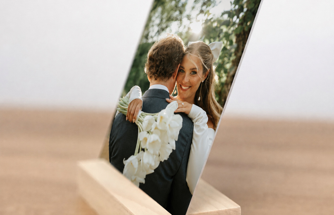 Side view of a wedding desk print resting in its solid wood display stand