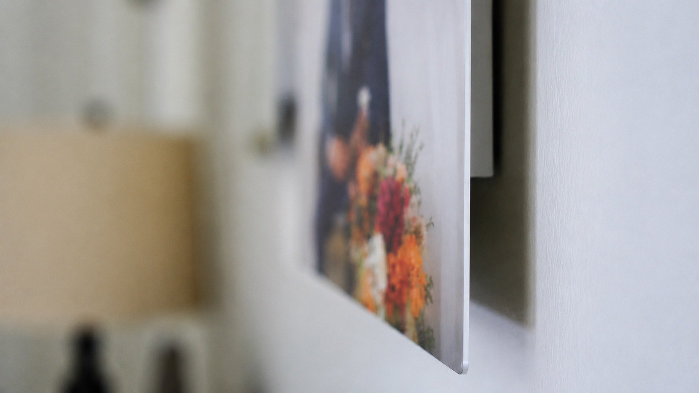 Close-up of a wedding metal print floating off the wall on its recessed float mount