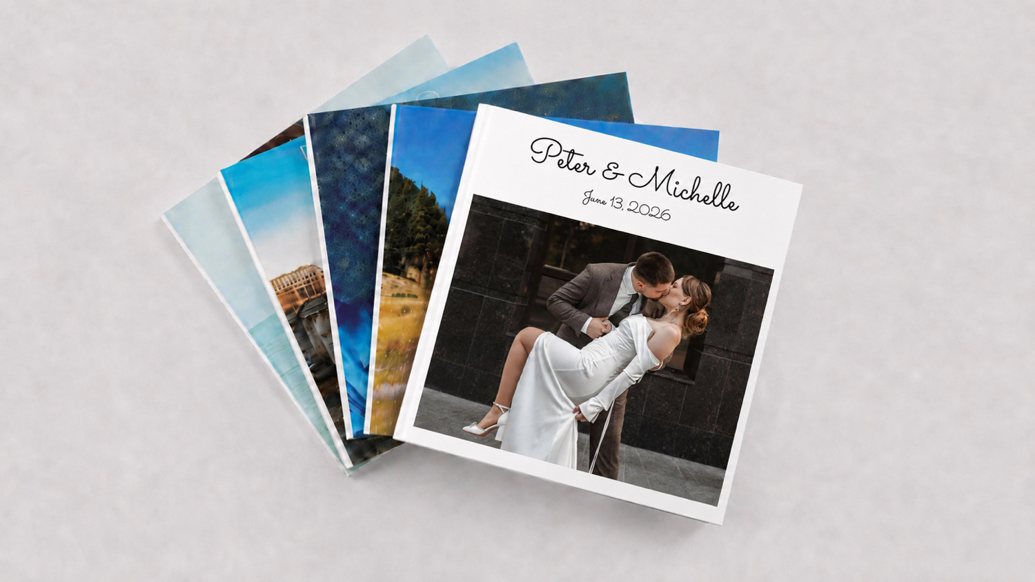 A stack of SimplePrints hardcover wedding photo books