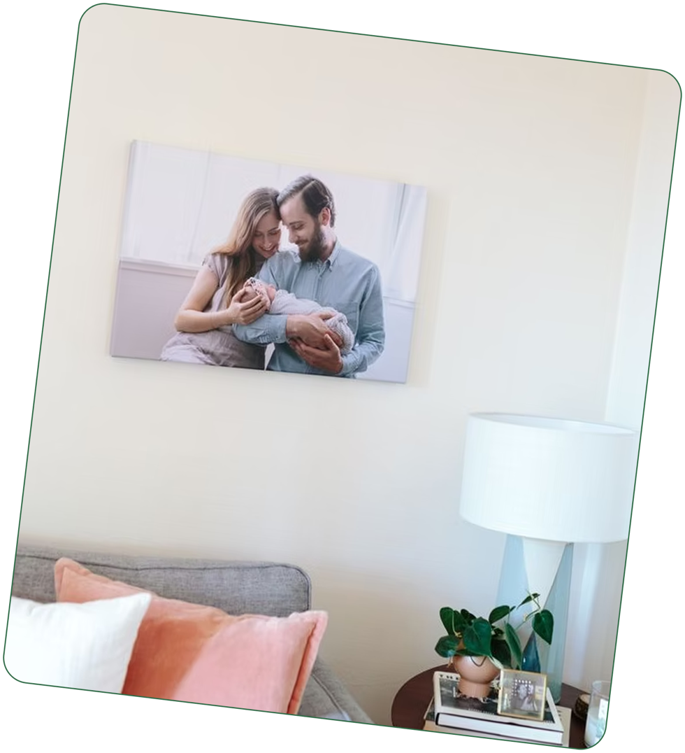 A canvas print of new parents holding their baby