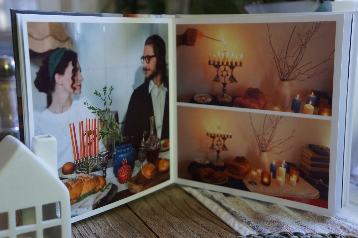 A photo book personalized gift depicting a couple celebrating hanukkah