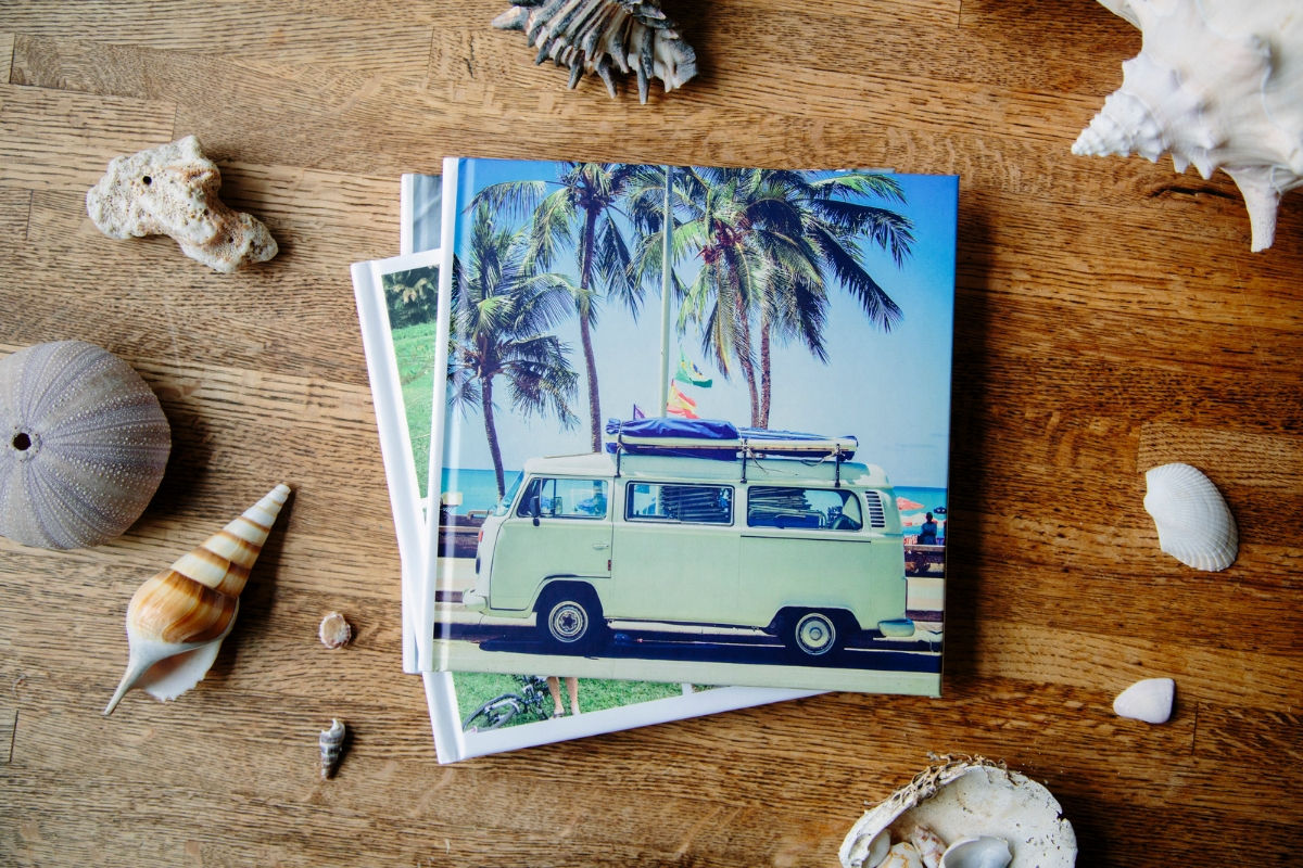 Stack of SimplePrints Photo books with the top one being a vacation photo book