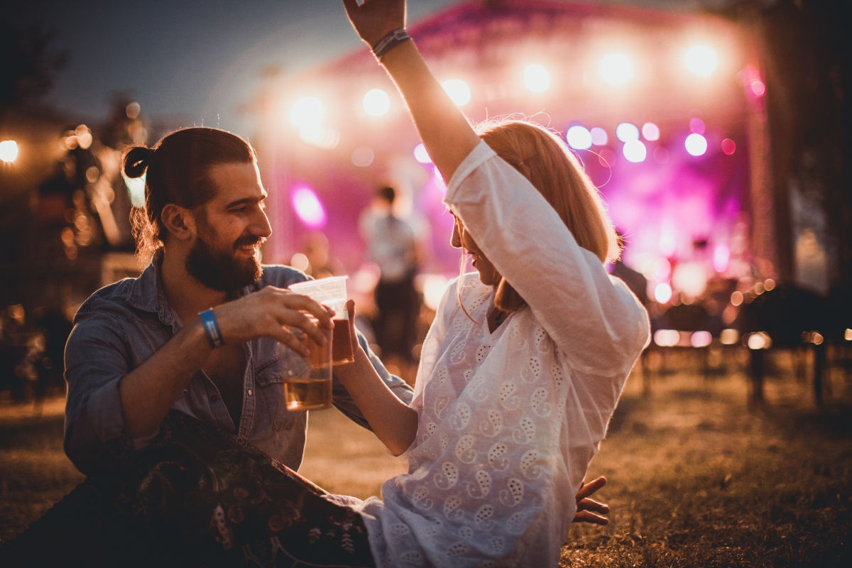 couple cheering in a music festival
