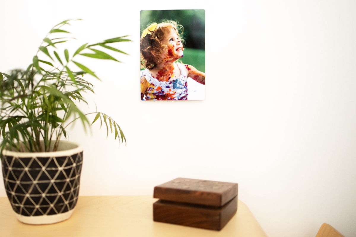 Small SimplePrints Metal Print with picture of a girl covered in paint and smiling
