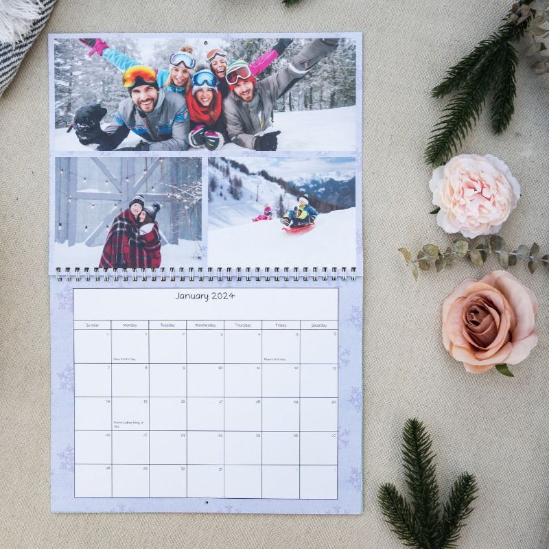 January Calendar featuring ski photos and a purple snowflake background