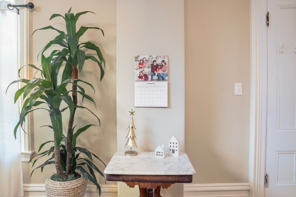 Wall calendar personalized gift with images of a family celebrating Christmas for the month of December.