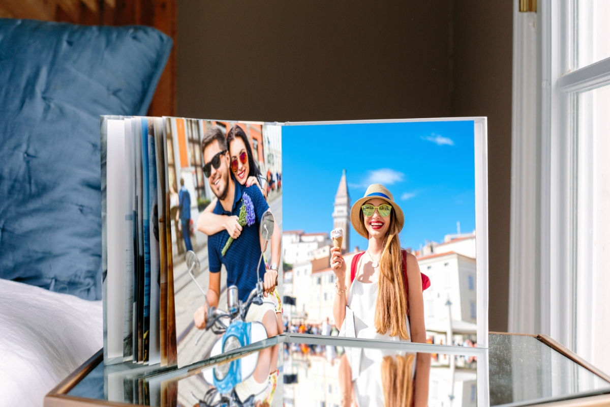SimplePrints photo books of a vacation on top of a glass table.