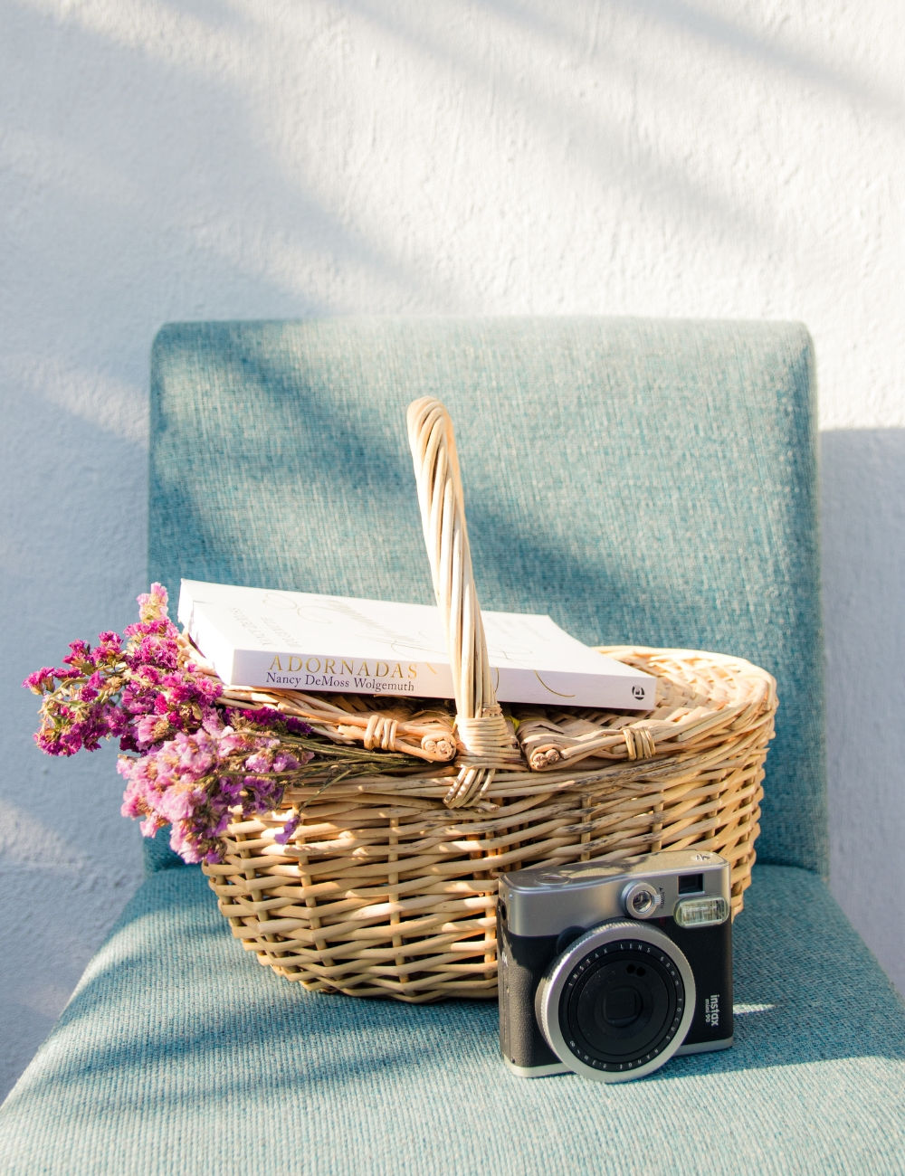 Valentine gift basket with a camera and flowers