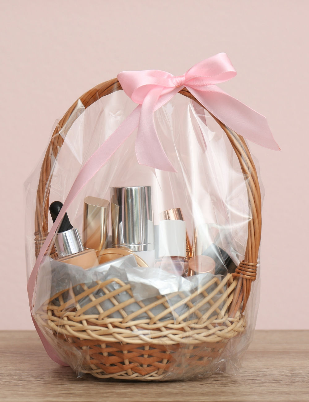 Valentine gift basket with make-up wrapped with a pink bow