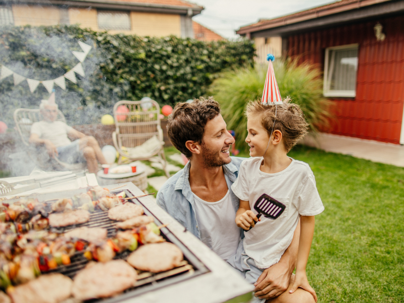 Dad and son at a BBQ