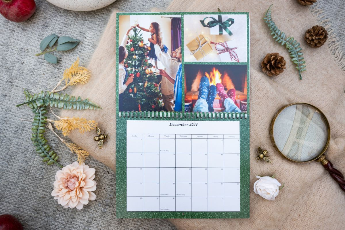 a wall calendar featuring Christmas photos for the month of December