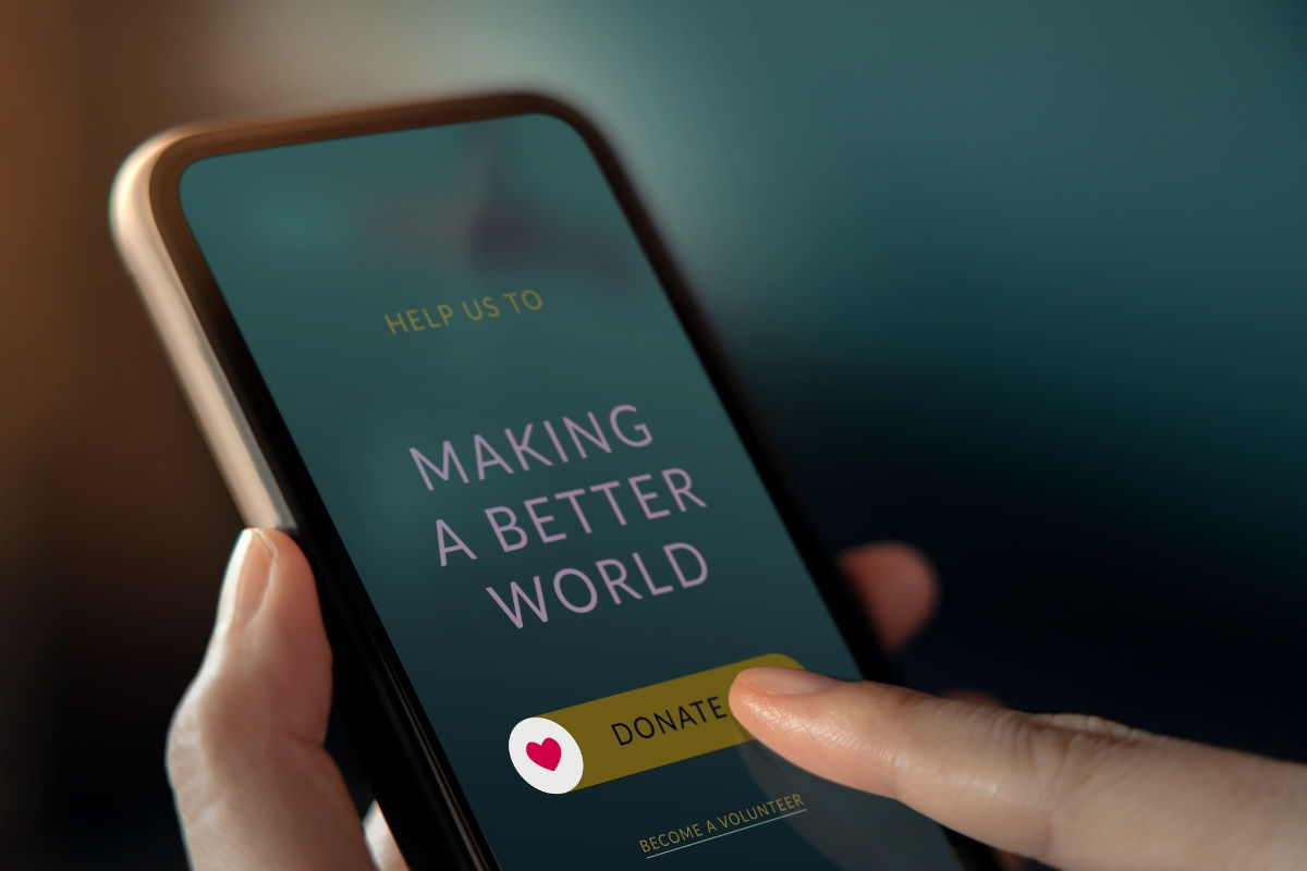 a phone screen saying "making the world a better place" with a donate button