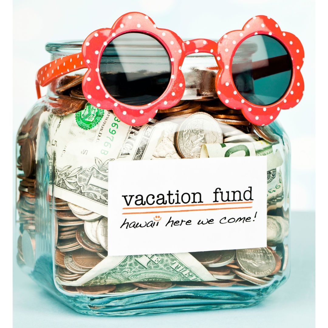 A glass jar filled with coins and bills labeled "vacation fund: Hawaii here we come!" Topped with red polka dot sunglasses. Cheerful mood.