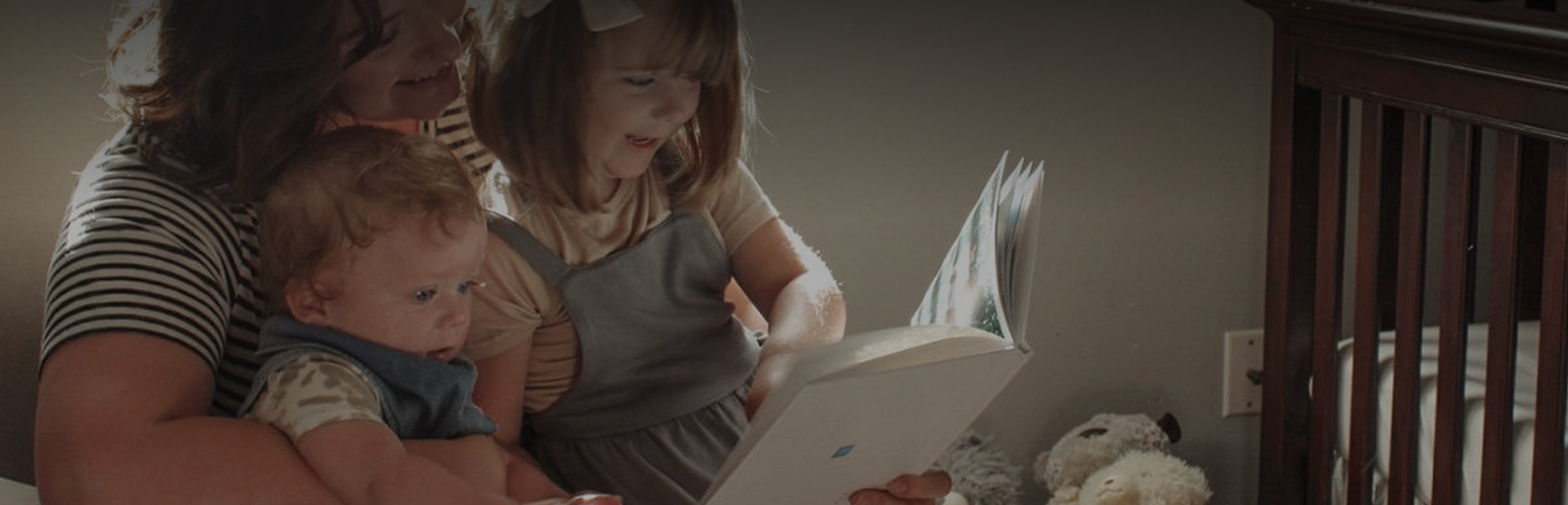 A family looking through their SimplePrints photo book together
