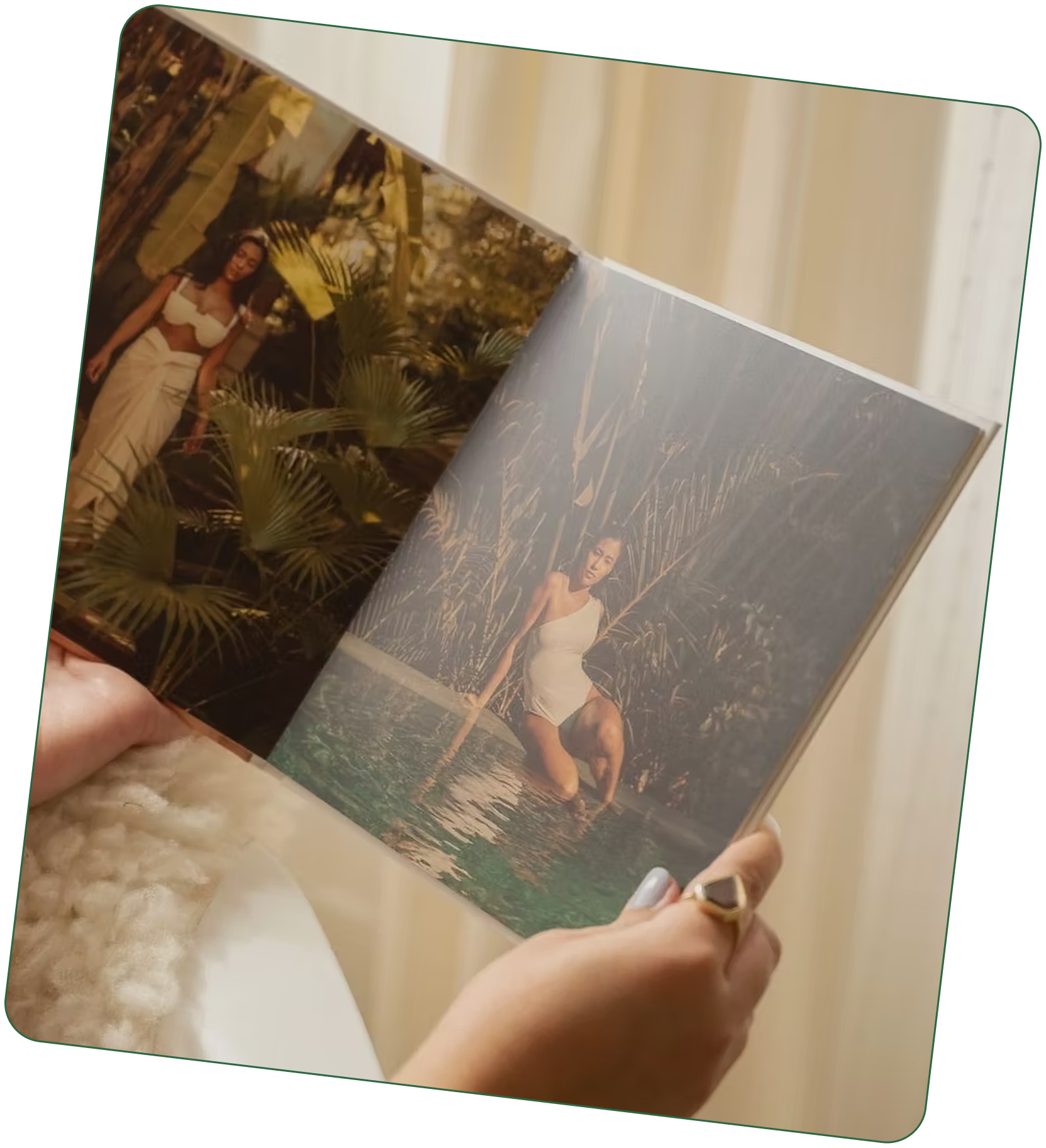 A woman modeling a layflat photo book, showing its uninterrupted photo spread