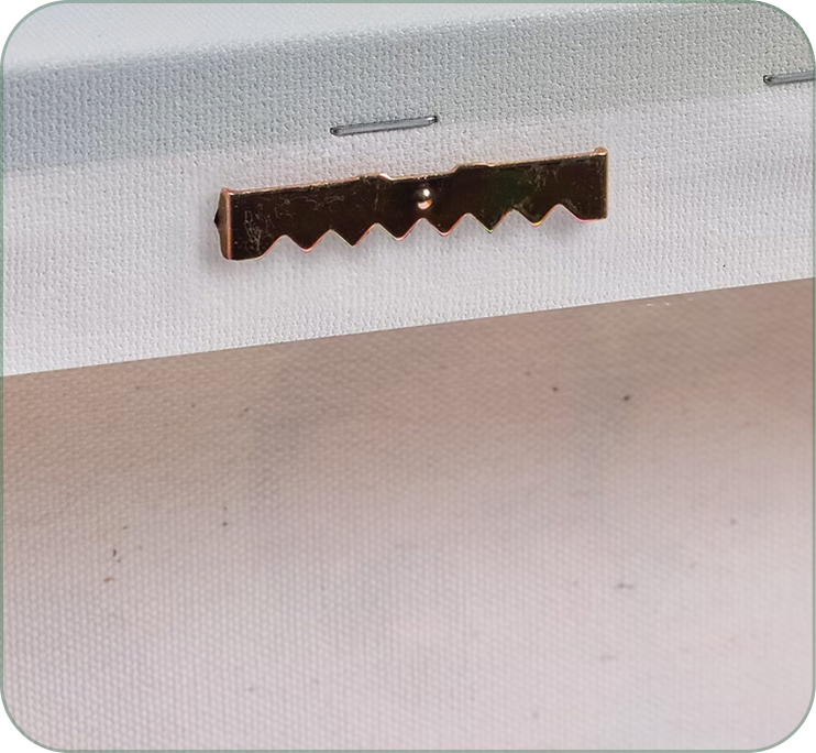 Close-up of the metal hanging hardware on a canvas print