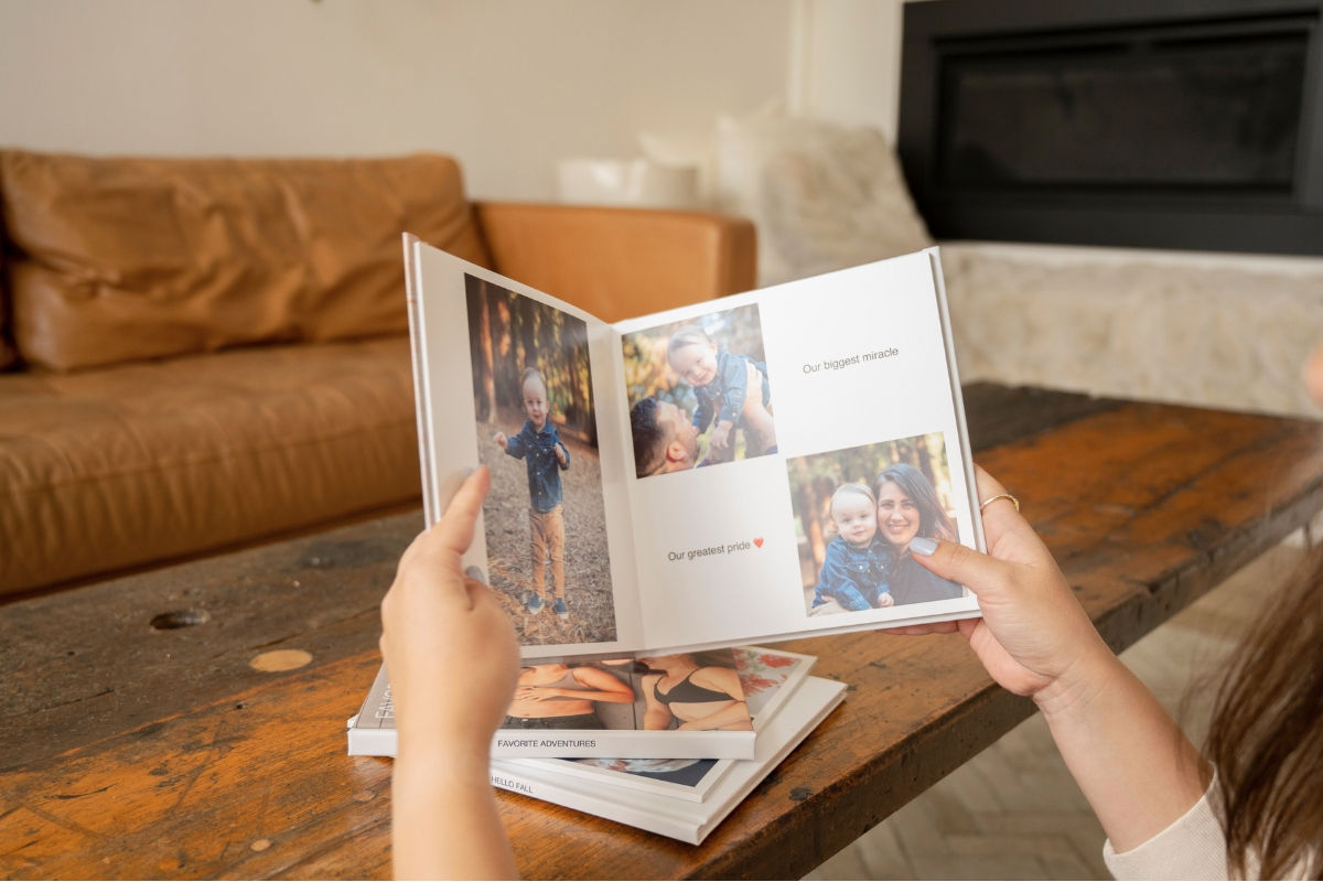 Person holding SimplePrints Hardcover photo book