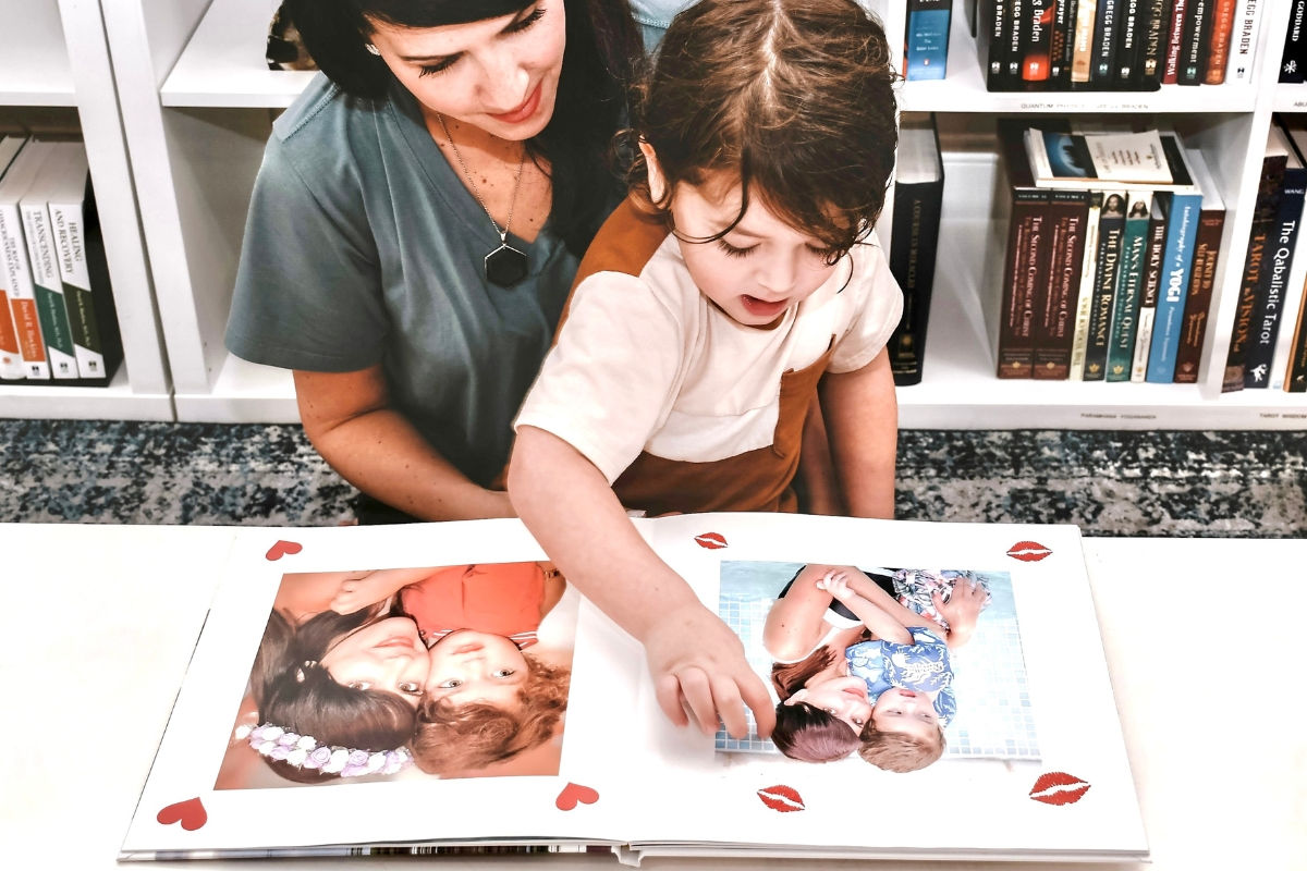 mom and child looking at a SimplePrints photo book