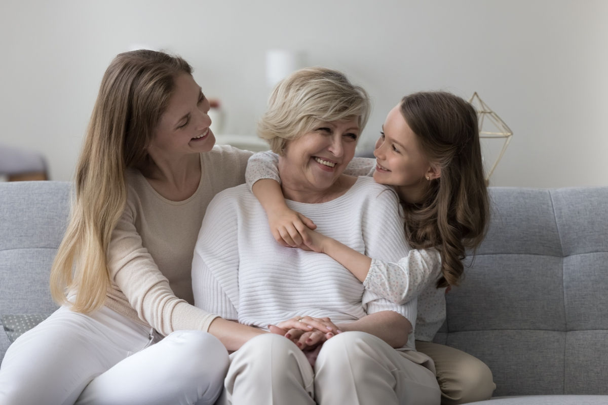 Grandmother, Mother, and Daughter embracing
