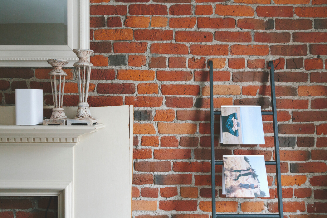 An upcycled wooden ladder can be used to display photo books by SimplePrints or hang blankets.